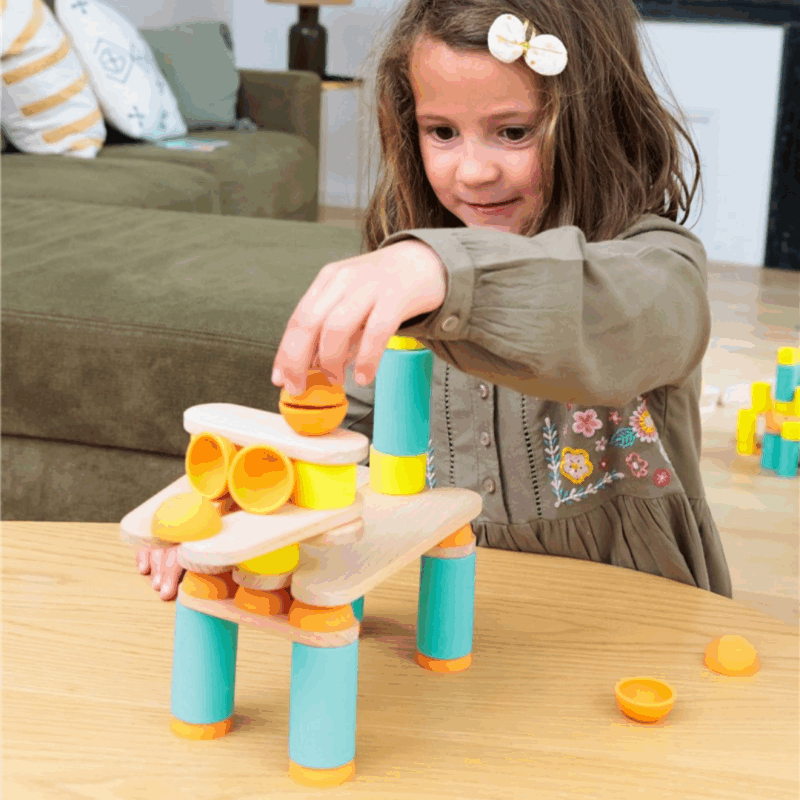 Juego de construcción Stix 60 con piezas de silicona y madera para estimular la creatividad y la motricidad infantil